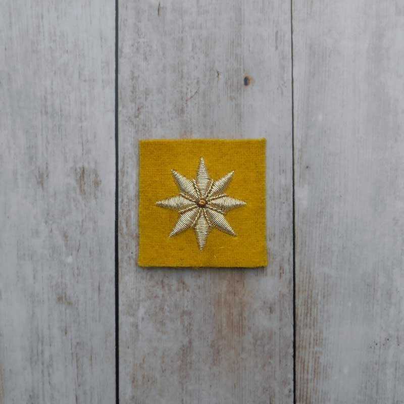 Embroidered yellow star in gold string length